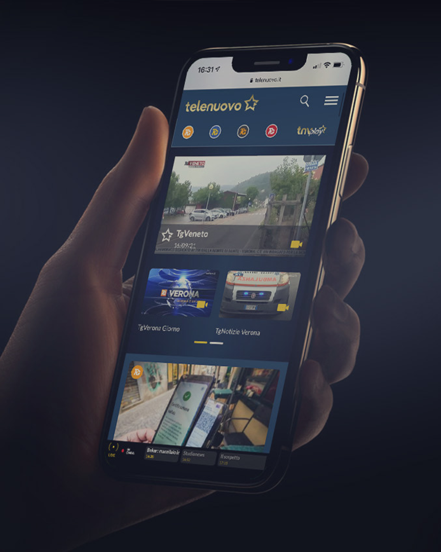 Interfaccia mobile dell'app Telenuovo con video e notizie in evidenza, che mostra una navigazione intuitiva e contenuti multimediali aggiornati